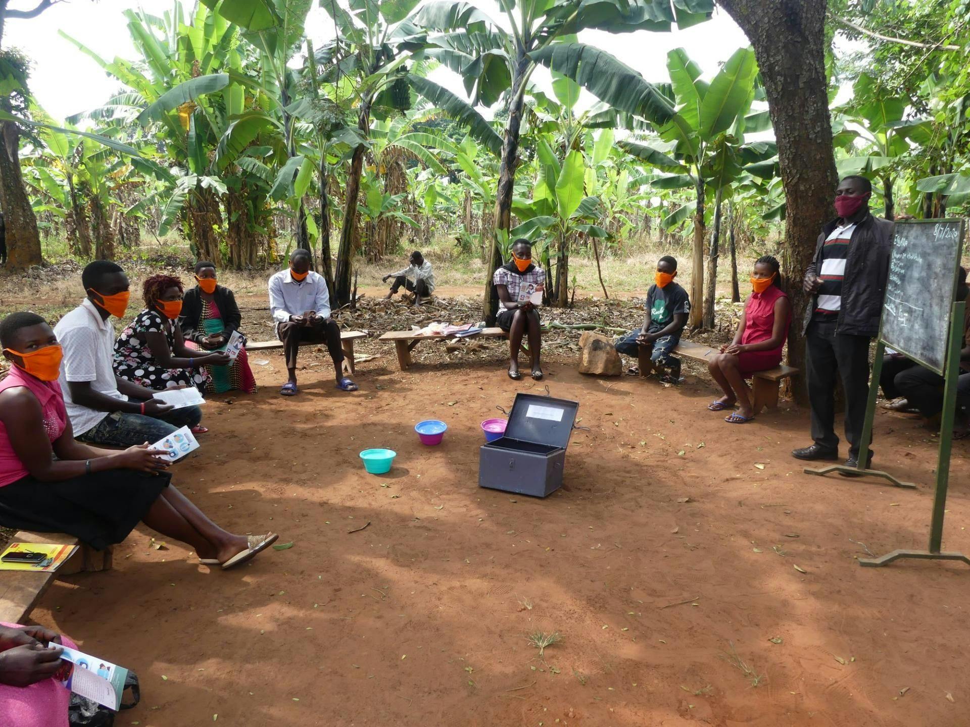 A VSLA session taking place in Mityana, Uganda while adhering to SOPs